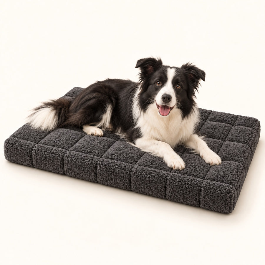 RestWell orthopedic crate mat in charcoal, studio photo with a dog